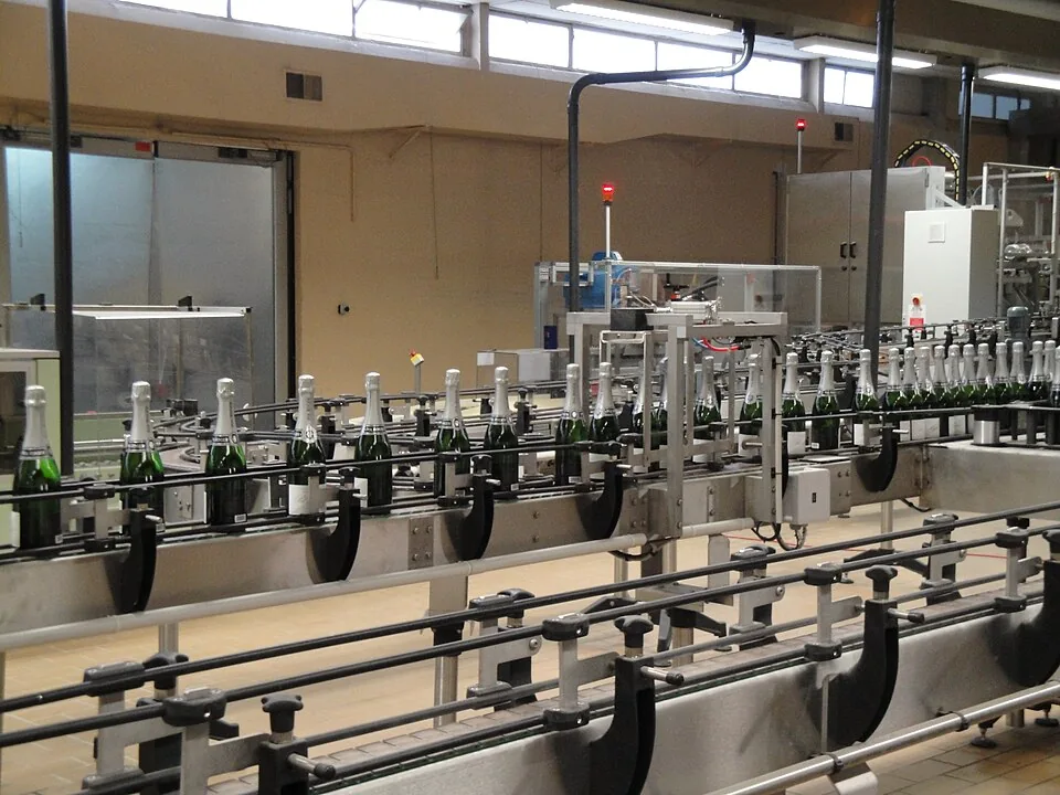 Bottles moving through an automated labelling line